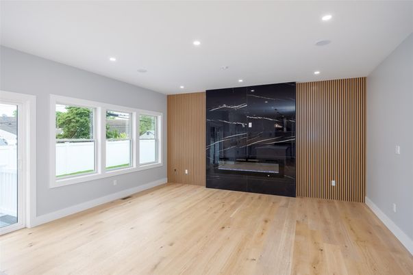Empty room, Fireplace, Interior, Marble Walls, Recessed Lighting, Wood Texture Flooring
