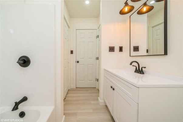 Bathroom, Dual Sink Vanities, Interior, Recessed Lighting, Wood Texture Flooring