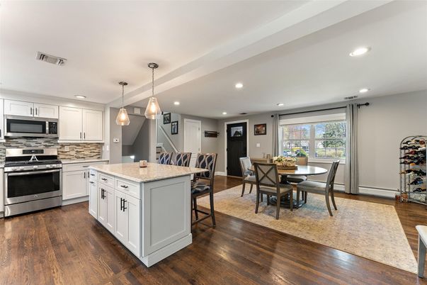 Dining room, Interior, Kitchen, Pendant Lights, Recessed Lighting, Stainless Steel Appliances, Wood Texture Flooring
