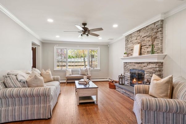 Fireplace, Interior, Living room, Recessed Lighting, Stone Walls, Wood Texture Flooring