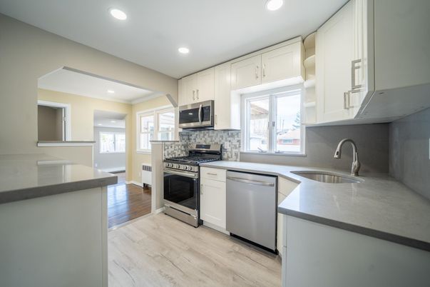 Interior, Kitchen, Recessed Lighting, Stainless Steel Appliances, Wood Texture Flooring