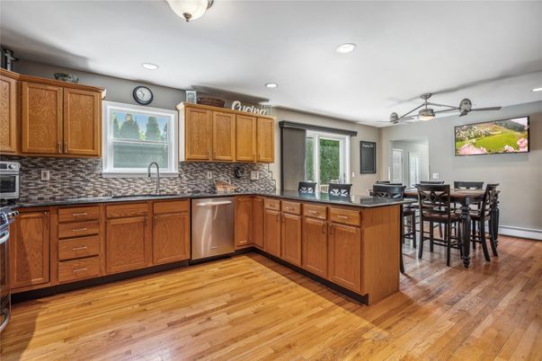 Dining room, Interior, Kitchen, Recessed Lighting, Stainless Steel Appliances, Wood Texture Flooring