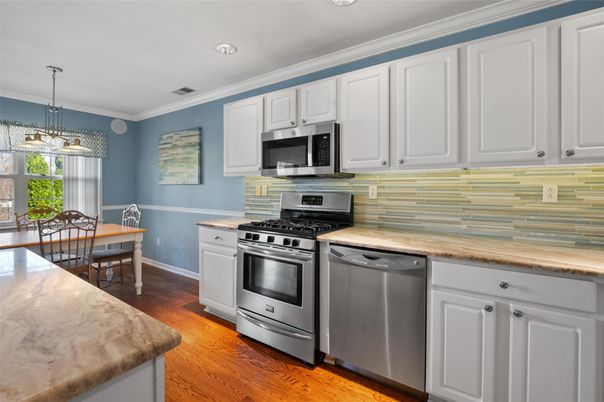 Dining room, Interior, Kitchen, Pendant Lights, Recessed Lighting, Stainless Steel Appliances, Wood Texture Flooring