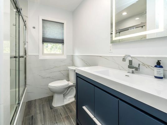 Bathroom, Glass Shower, Interior, Marble Walls, Recessed Lighting, Wood Texture Flooring