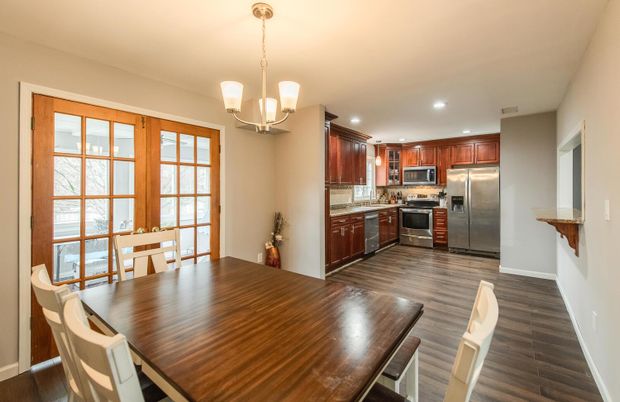 Chandelier, Dining room, Interior, Kitchen, Pendant Lights, Recessed Lighting, Stainless Steel Appliances, Wood Texture Flooring
