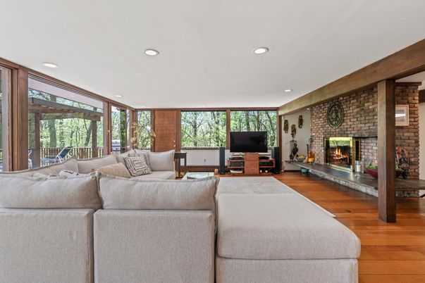Fireplace, Interior, Living room, Recessed Lighting, Stone Walls, Wood Texture Flooring