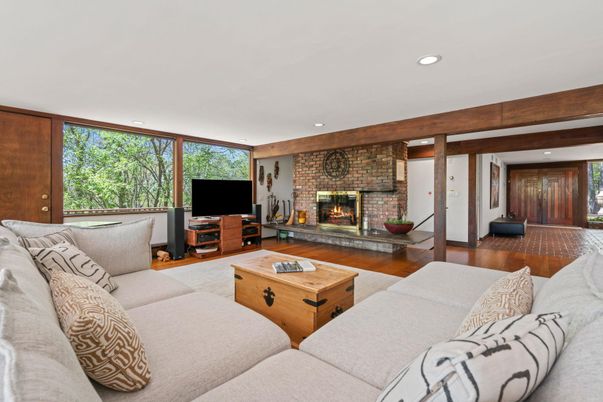 Fireplace, Interior, Living room, Recessed Lighting, Stone Walls, Wood Texture Flooring