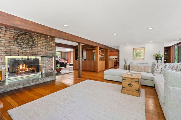 Fireplace, Interior, Living room, Recessed Lighting, Stone Walls, Wood Texture Flooring