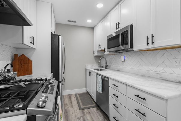 Interior, Kitchen, Recessed Lighting, Stainless Steel Appliances, Wood Texture Flooring