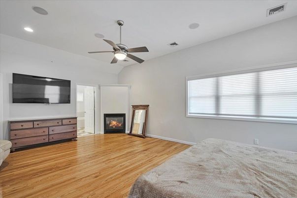 Bedroom, Fireplace, Interior, Recessed Lighting, Wood Texture Flooring