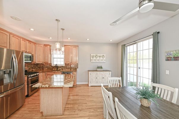 Dining room, Interior, Kitchen, Pendant Lights, Recessed Lighting, Stainless Steel Appliances, Wood Texture Flooring