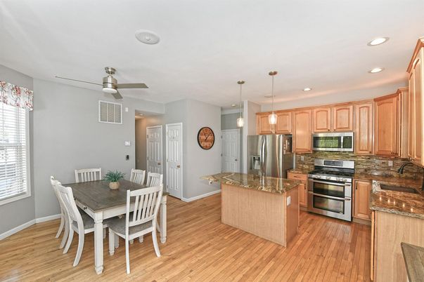 Dining room, Interior, Kitchen, Pendant Lights, Recessed Lighting, Stainless Steel Appliances, Wood Texture Flooring