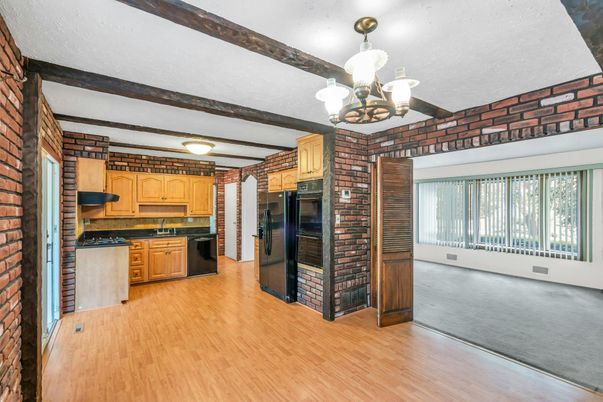 Chandelier, Interior, Kitchen, Stainless Steel Appliances, Stone Walls, Wood Texture Flooring