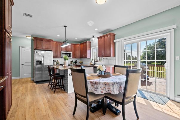 Dining room, Interior, Kitchen, Pendant Lights, Recessed Lighting, Stainless Steel Appliances, Wood Texture Flooring
