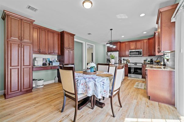 Dining room, Interior, Kitchen, Pendant Lights, Recessed Lighting, Stainless Steel Appliances, Wood Texture Flooring