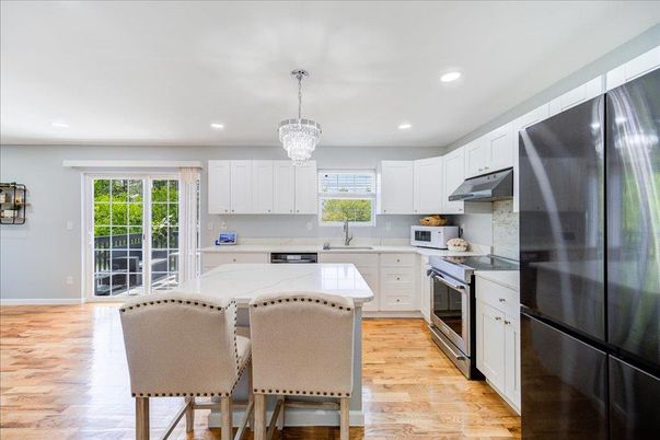 Chandelier, Interior, Kitchen, Recessed Lighting, Stainless Steel Appliances, Wood Texture Flooring