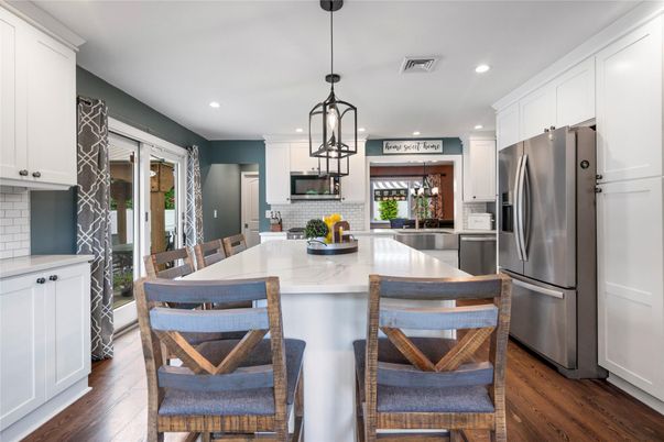 Dining room, Interior, Kitchen, Pendant Lights, Recessed Lighting, Stainless Steel Appliances, Wood Texture Flooring