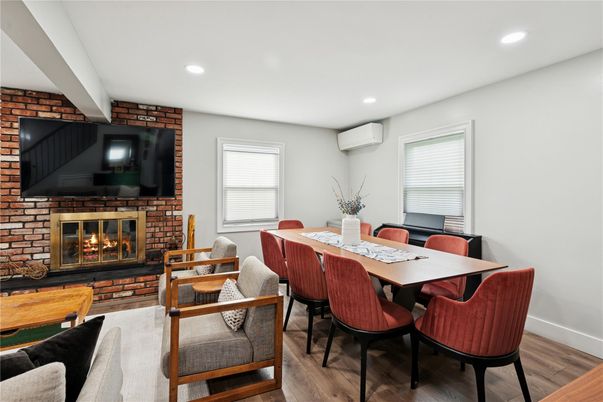 Dining room, Fireplace, Interior, Recessed Lighting, Stone Walls, Wood Texture Flooring