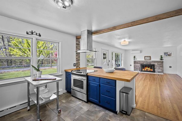 Fireplace, Interior, Kitchen, Stainless Steel Appliances, Wood Texture Flooring