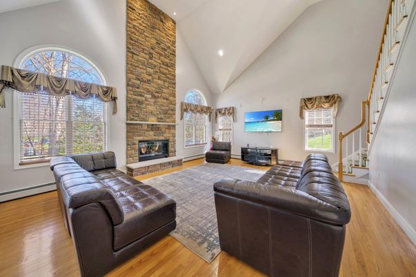 Fireplace, Interior, Living room, Recessed Lighting, Stone Walls, Wood Texture Flooring