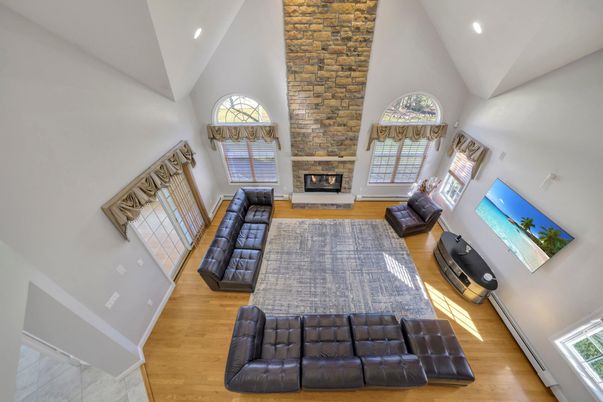 Fireplace, Interior, Living room, Recessed Lighting, Stone Walls, Wood Texture Flooring