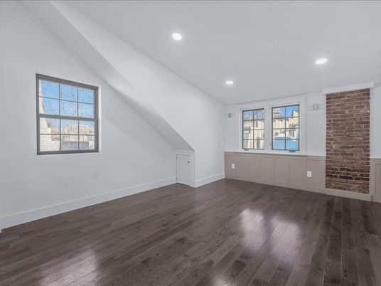 Empty room, Fireplace, Interior, Recessed Lighting, Stone Walls, Wood Texture Flooring