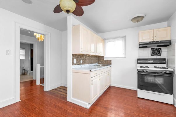 Chandelier, Interior, Kitchen, Tile Countertops, Wood Texture Flooring