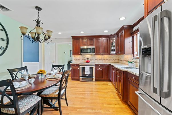 Chandelier, Dining room, Interior, Kitchen, Recessed Lighting, Stainless Steel Appliances, Wood Texture Flooring