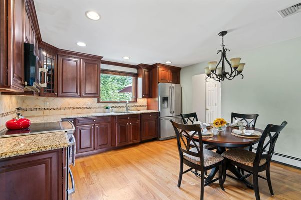 Chandelier, Dining room, Interior, Kitchen, Recessed Lighting, Stainless Steel Appliances, Wood Texture Flooring