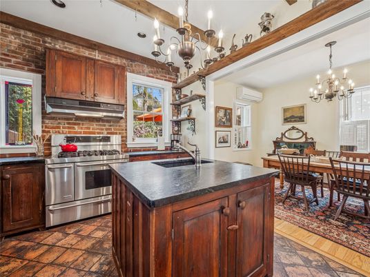 Chandelier, Dining room, Interior, Kitchen, Stainless Steel Appliances, Stone Walls, Wood Texture Flooring