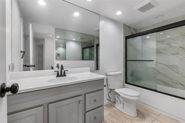 Bathroom, Glass Shower, Interior, Marble Walls, Recessed Lighting, Wood Texture Flooring