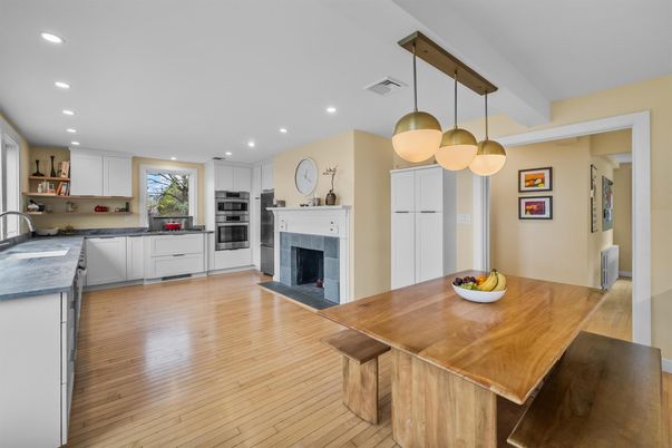 Dining room, Fireplace, Interior, Kitchen, Pendant Lights, Recessed Lighting, Stainless Steel Appliances, Wood Texture Flooring
