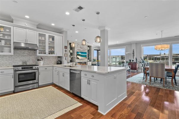 Dining room, Interior, Kitchen, Pendant Lights, Recessed Lighting, Stainless Steel Appliances, Wood Texture Flooring