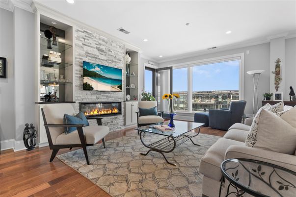 Fireplace, Interior, Living room, Recessed Lighting, Stone Walls, Wood Texture Flooring