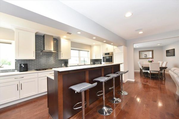 Dining room, Interior, Kitchen, Recessed Lighting, Stainless Steel Appliances, Wood Texture Flooring