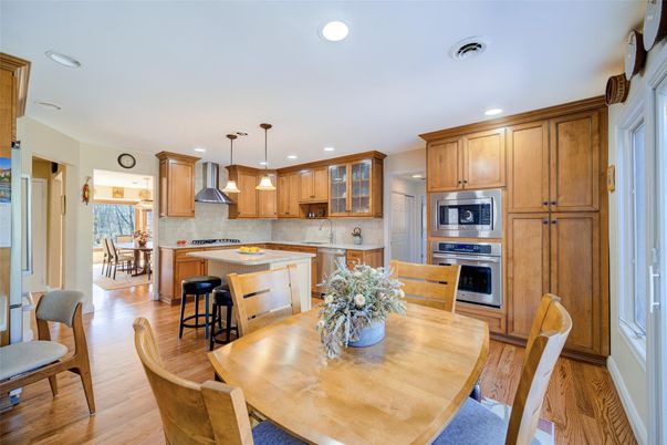 Dining room, Interior, Kitchen, Pendant Lights, Recessed Lighting, Stainless Steel Appliances, Wood Texture Flooring