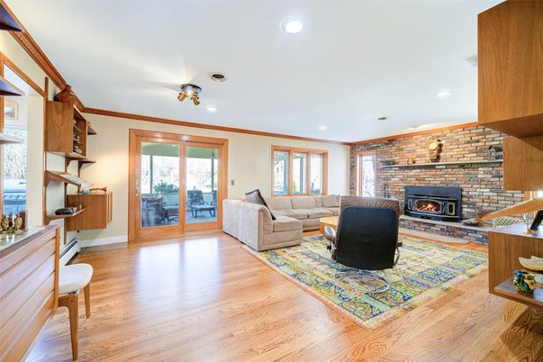 Fireplace, Interior, Living room, Recessed Lighting, Stone Walls, Wood Texture Flooring
