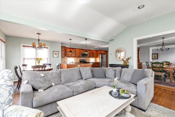 Chandelier, Dining room, Interior, Kitchen, Living room, Pendant Lights, Recessed Lighting, Stainless Steel Appliances, Wood Texture Flooring