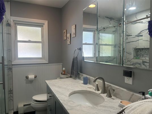 Bathroom, Dual Sink Vanities, Glass Shower, Interior, Marble Walls, Recessed Lighting