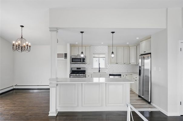 Chandelier, Interior, Kitchen, Pendant Lights, Recessed Lighting, Stainless Steel Appliances, Wood Texture Flooring