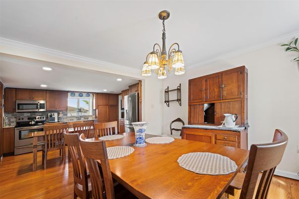 Chandelier, Dining room, Interior, Kitchen, Recessed Lighting, Stainless Steel Appliances, Wood Texture Flooring