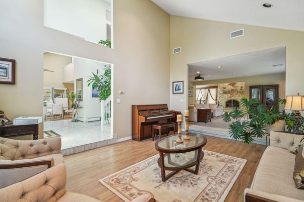 Fireplace, Interior, Living room, Piano, Recessed Lighting, Stone Walls, Wood Texture Flooring