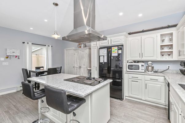 Dining room, Interior, Kitchen, Pendant Lights, Recessed Lighting, Stainless Steel Appliances, Wood Texture Flooring