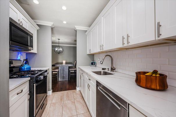 Dining room, Interior, Kitchen, Pendant Lights, Recessed Lighting, Stainless Steel Appliances, Wood Texture Flooring