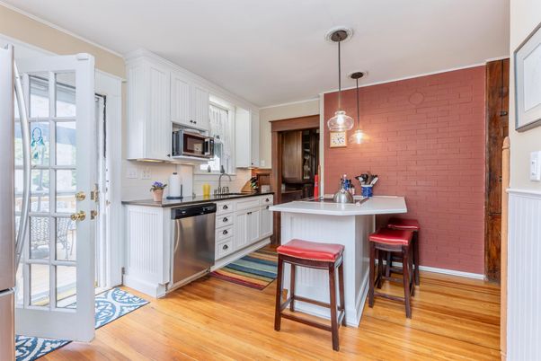 Interior, Kitchen, Pendant Lights, Stainless Steel Appliances, Stone Walls, Wood Texture Flooring