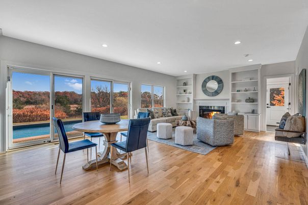 Dining room, Fireplace, Interior, Living room, Recessed Lighting, Wood Texture Flooring