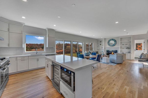 Dining room, Fireplace, Interior, Kitchen, Living room, Recessed Lighting, Stainless Steel Appliances, Wood Texture Flooring
