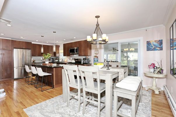 Chandelier, Dining room, Interior, Kitchen, Pendant Lights, Recessed Lighting, Stainless Steel Appliances, Wood Texture Flooring