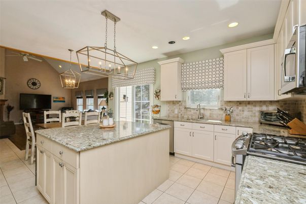 Chandelier, Dining room, Interior, Kitchen, Living room, Pendant Lights, Recessed Lighting, Stainless Steel Appliances