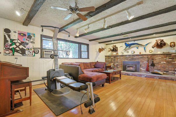 Fireplace, Fitness Equipment, Interior, Living room, Piano, Stone Walls, Wood Texture Flooring